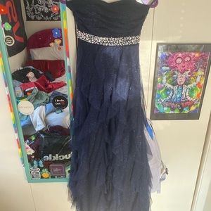 Never worn! Sparkly navy blue prom dress with rhinestones, zipper and ribbon.